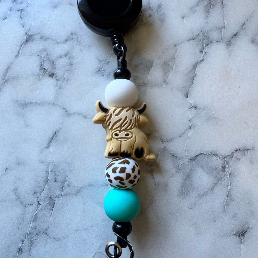 Highland cow badge reel
